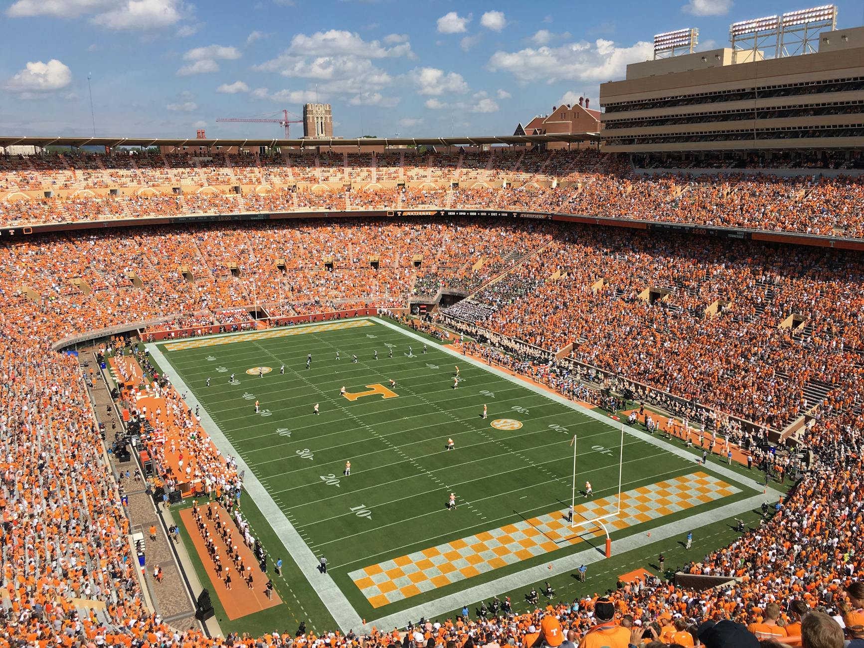 aerial shot of a football stadium with people